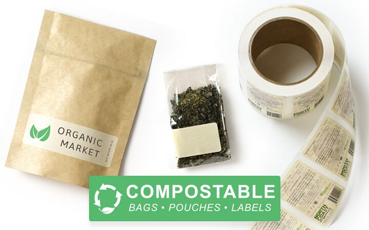 Stack of compostable packaging trays and bowls with green leaf background